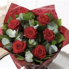 Six red roses in Handtied Bag